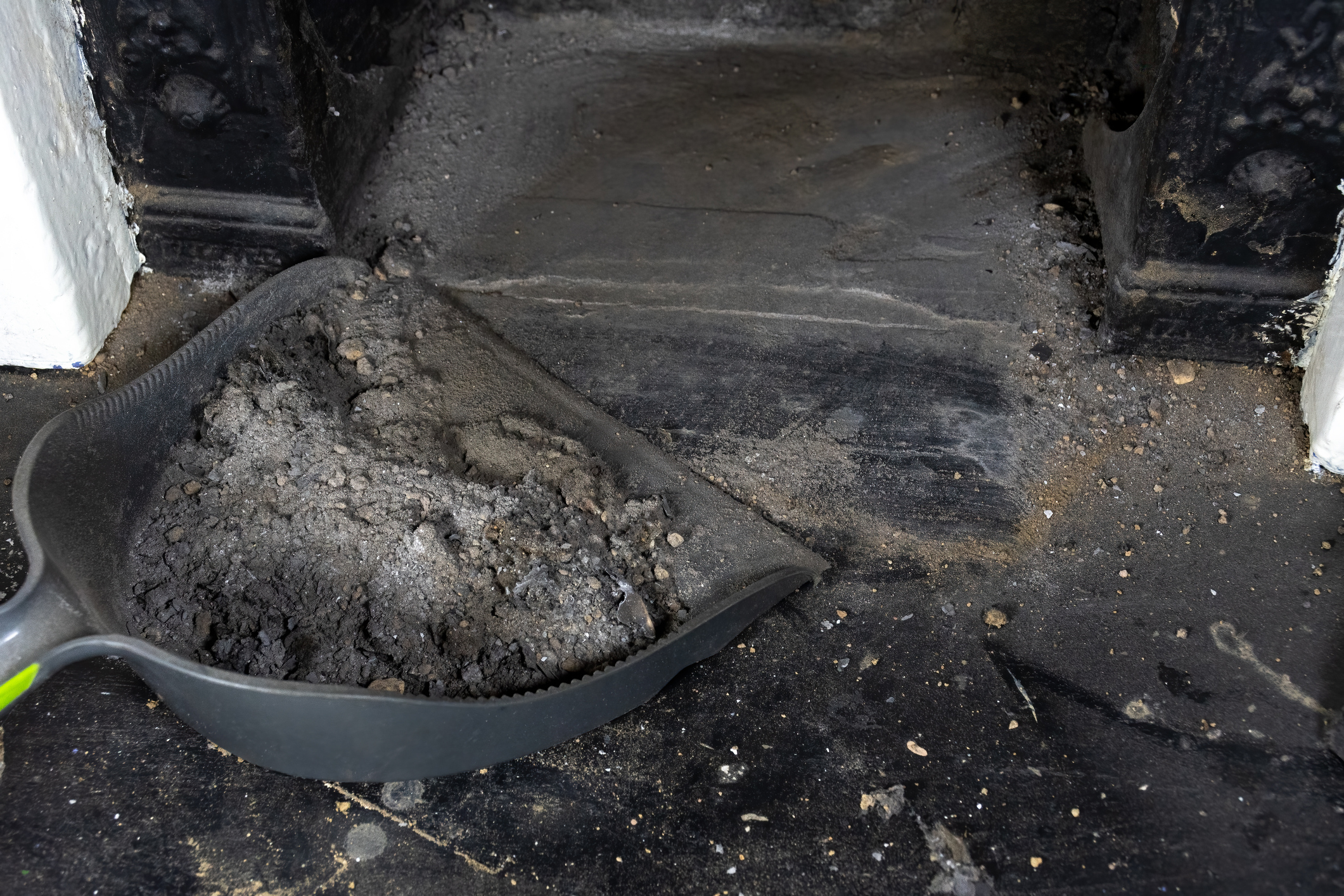 Sweeping up dirty fireplace